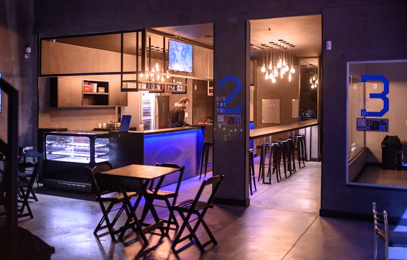 Wings over stylish bar area with neon lighting